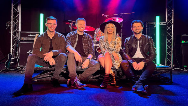 Groove-Eternal-Wedding-Band-For-Hire-On-Stage-Sitting